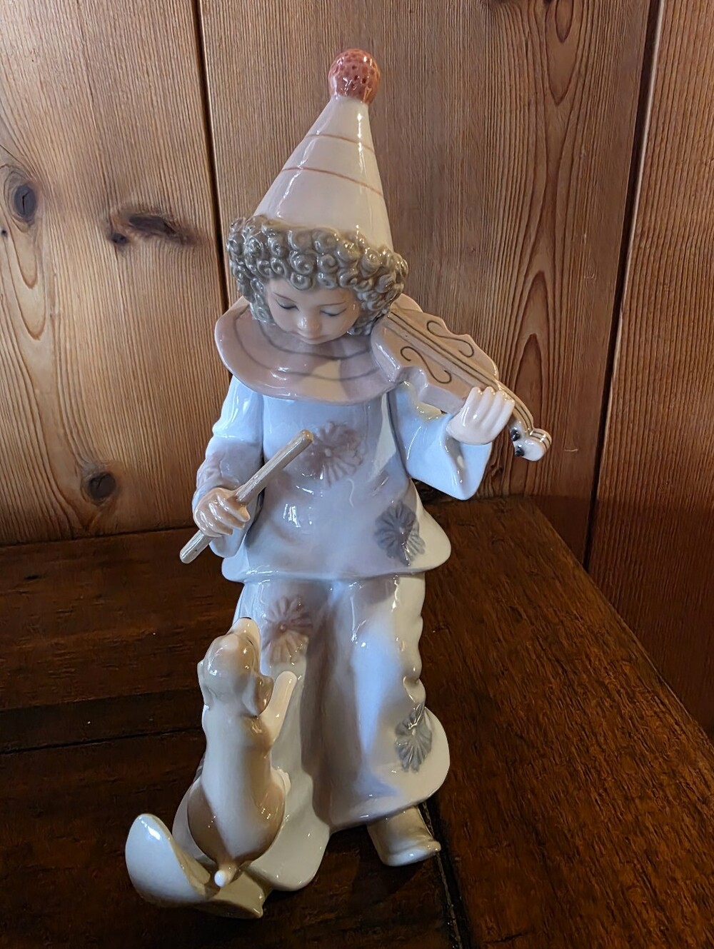 Vintage Porcelain Figurine .  Clown Playing The Violin With Puppy At His Feet.